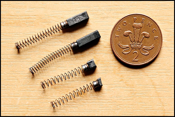 Picture of two pairs of Singer sewing machine motor brushes